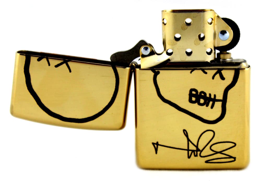 Norman Reedus Exclusive Zippo Lighter with Big Bald Head Logo – Brass with Black Logo Norman Reedus Other norman-reedus-zippo-lighter-big-bald, view 2, supplier stock photo